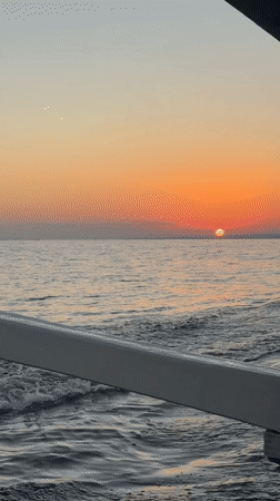 Sunset over calm seas off Banjar, Indonesia