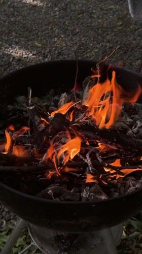 Charcoal grilling session in Erba yard