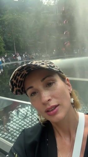 Woman films at Jewel Changi Airport's waterfall Singapore