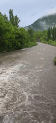 Fast-flowing river with strong currents observed near Seira, Spain