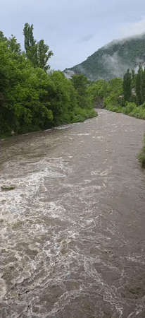 Fast-flowing river with strong currents observed near Seira, Spain