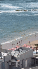 Crowded beach day observed in Bat Yam, Israel