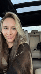 Woman photographed smiling in driver's seat in Moscow