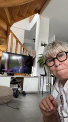 Woman enjoys quiet Sunday afternoon with cat in Chambœuf