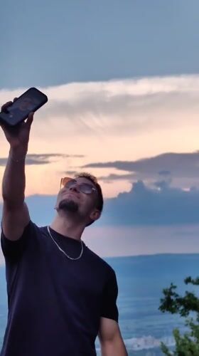 Men take sunset selfies at Bulgarian historical site