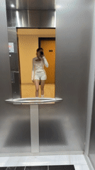Woman takes elevator selfie in Dubai building