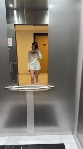 Woman takes elevator selfie in Dubai building