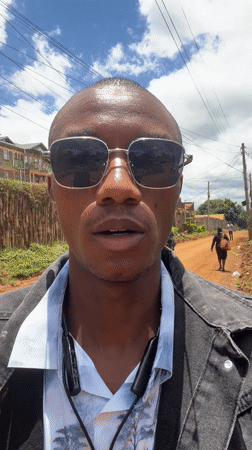 Man takes selfies on dirt road in Nyeri