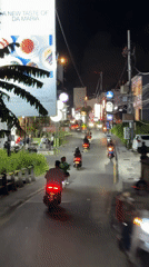 Morning scooter traffic flows through North Kuta streets