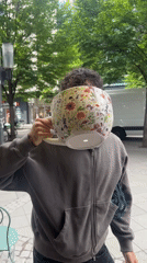 Man with oversized floral mug spotted in Berlin