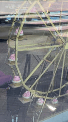 Rotating cupcake Ferris wheel display spotted in Novosibirsk window