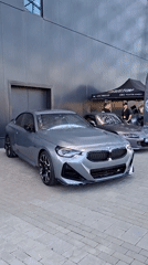 BMW M2 parked outside a modern building in Stăuceni