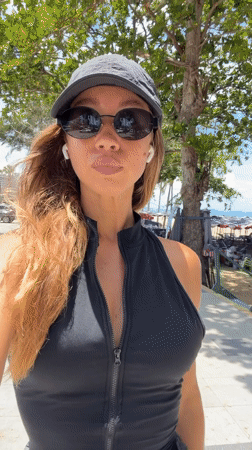 Woman walks beachside path in early morning Pattaya