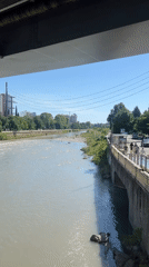 Casual moments captured along Sochi riverfront during sunny afternoon