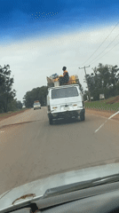 Loaded van travels cracked road in Durimi, Nigeria
