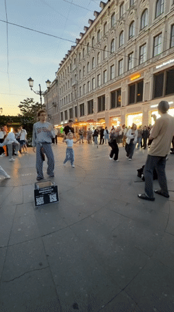 Breakdancers take over a Saint Petersburg plaza at dusk