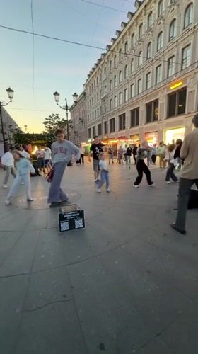 Breakdancers take over a Saint Petersburg plaza at dusk