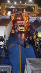 Night ferry crossing at Melaya, decks loaded with trucks