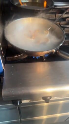 Cooking flames flare orange after liquid added to Leeds pan