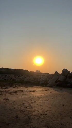 Caspian beach at golden hour, Baku coastline buzzing