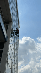 Window washers clean office building facade in Dolgoprudny