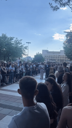 Crowd gathers at American University Bulgaria campus, boxing training observed