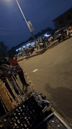 Evening market bustles with vendors, shoppers in Bukuru, Nigeria