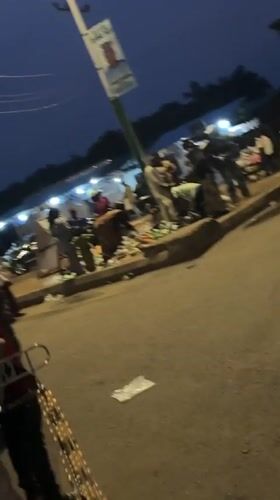 Evening market bustles with vendors, shoppers in Bukuru, Nigeria