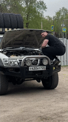 Man repairs engine of 4WD vehicle in Blagoveshchensk