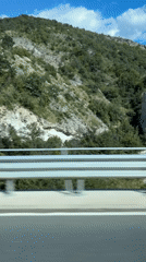 Highway travel recorded near Asparuhovo, Bulgaria shows hillside landscape
