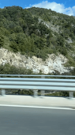 Highway travel recorded near Asparuhovo, Bulgaria shows hillside landscape