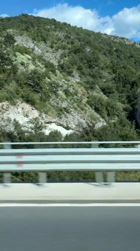 Highway travel recorded near Asparuhovo, Bulgaria shows hillside landscape