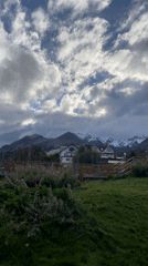 Snow-covered mountains filmed under cloudy skies in Ushuaia