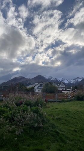 Snow-covered mountains filmed under cloudy skies in Ushuaia
