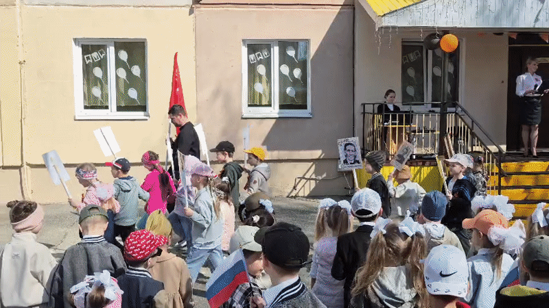 Children commemorate Victory Day with flags in Tobolsk, Russia