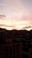 Caracas residents witness city's dusk-to-night transition May 24
