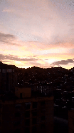 Caracas residents witness city's dusk-to-night transition May 24
