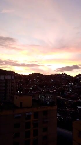 Caracas residents witness city's dusk-to-night transition May 24