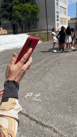 Students release colored smoke bombs at school gathering in Bulgaria