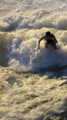 Eisbach wave draws a steady crowd of river surfers at dusk