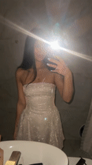 Woman Takes Selfie in Sparkly Dress in Khimki Bathroom