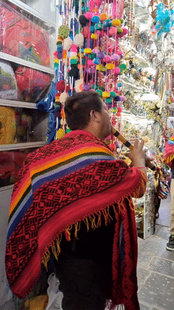 Political campaign event features traditional musicians in Cusco market