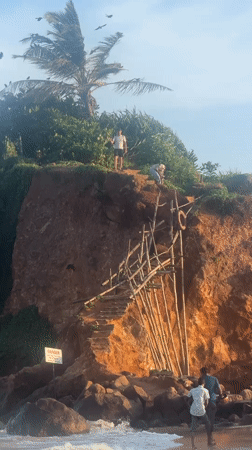 Man observes ocean view from clifftop in Thalaramba, Sri Lanka