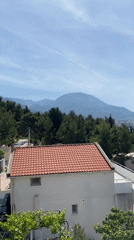 Man spotted eating, posing with banana on Montenegro balcony