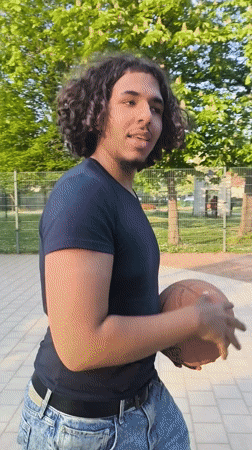 Man enjoys afternoon recreation at Strasbourg park and basketball court