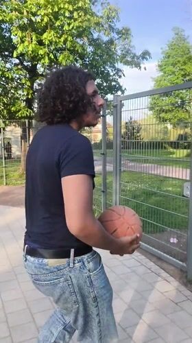 Man enjoys afternoon recreation at Strasbourg park and basketball court
