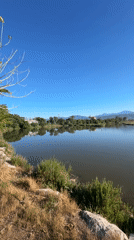 Tourists document sunny morning scenes in Fethiye, Turkey bay