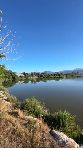 Tourists document sunny morning scenes in Fethiye, Turkey bay