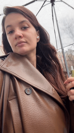 Woman enjoys rainy afternoon in Belgrade's Savamala district