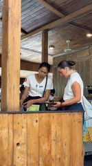 Restaurant staff serve customer in Kuta Selatan establishment